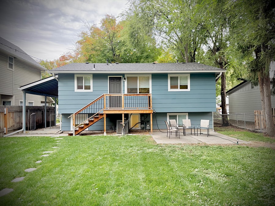 Back of the house, patio, fully fenced backyard.