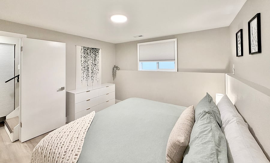 Downstairs bedroom, King bed, blackout shades, dresser.