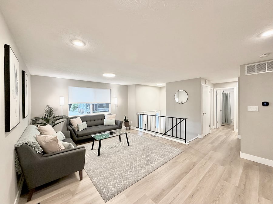 Livingroom, hall to bathroom and two bedrooms, storage closets, stairs to front door and lower level.