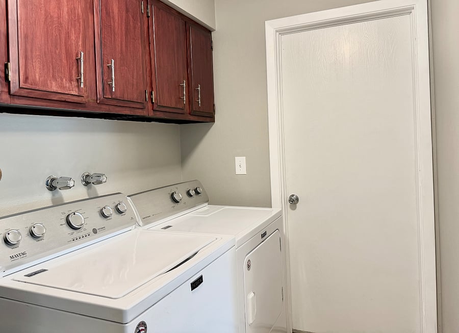 Laundry area - door to 2 car garage and backyard.