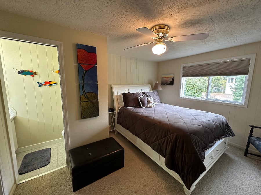 Bedroom 1 - Queen bed w/ ensuite half bath.