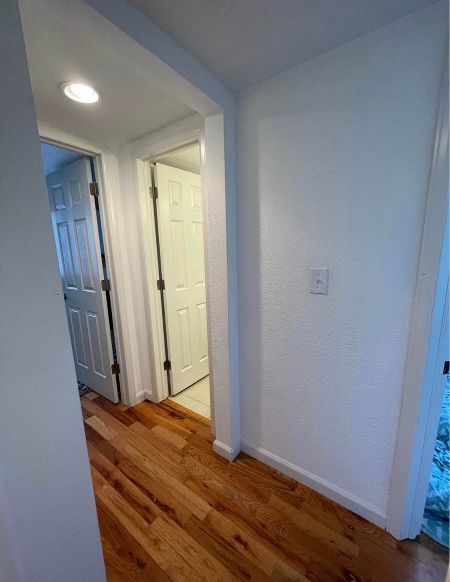 hallway of unit facing bathroom / living room