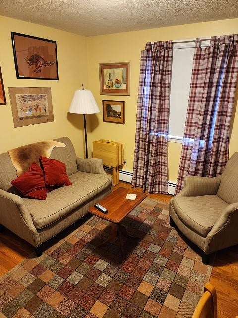 Den has a desk, small tv, students fridge. Quiet and cozy. Some shelving storage.