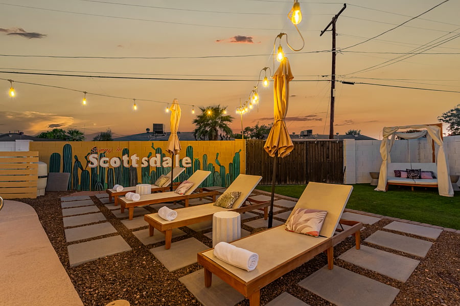 6 resort like lounge chairs with umbrellas