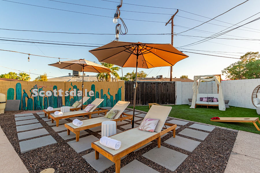 6 resort like lounge chairs with umbrellas