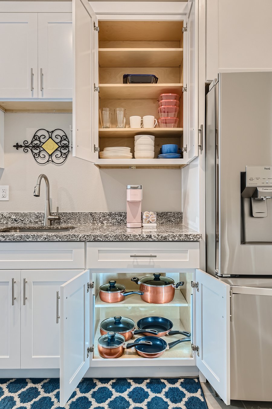 Cupboards have all the basics you'll need to cook and eat. Pod-style coffee maker too.