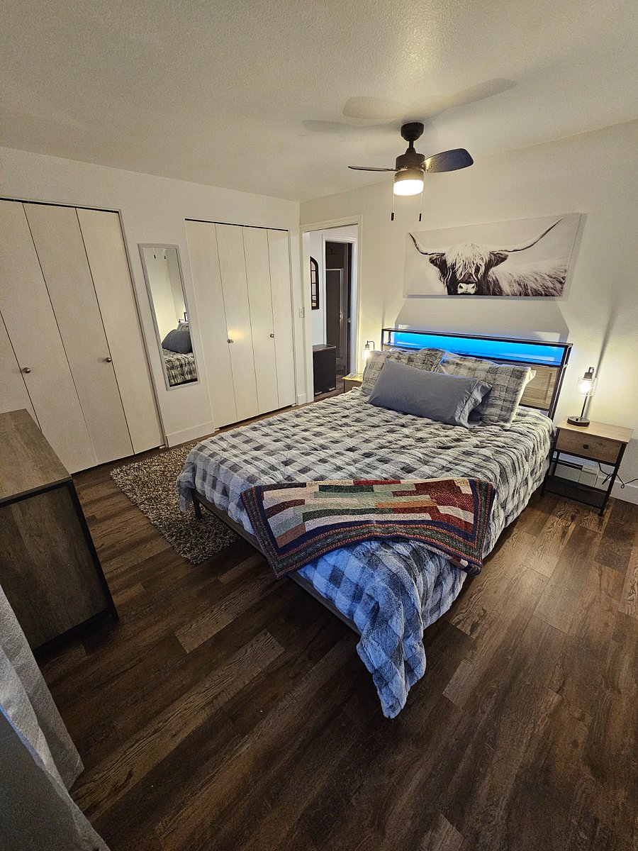 Queen bed with LED headboard lighting. 