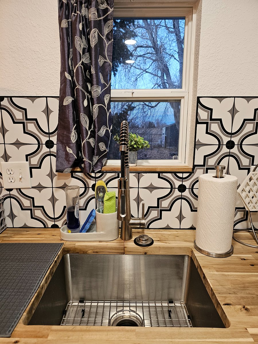 Deep kitchen sink looking out into the pasture. 