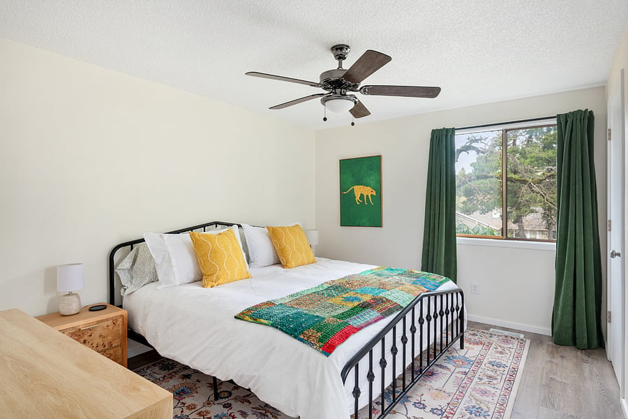 Master bedroom with King bed, walk in closet and bathroom with shower.