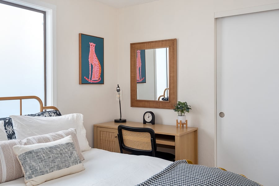 2nd bedroom with queen bed and work space.
