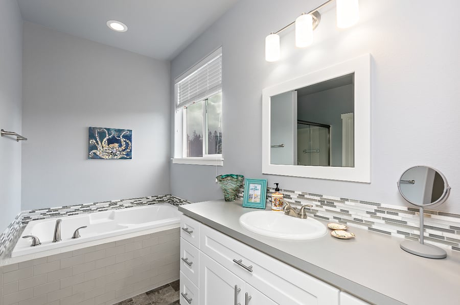 Personal bathroom with soaking bath and separate shower.