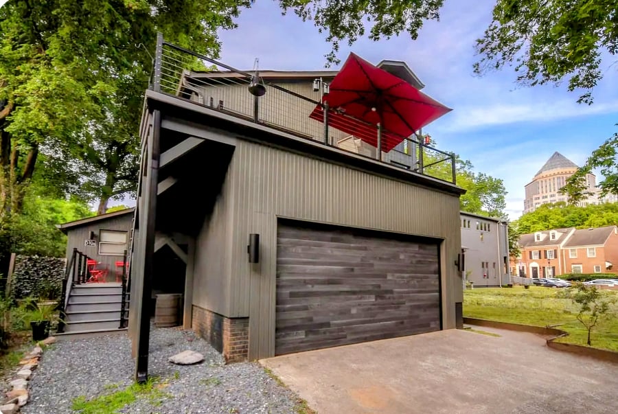 The apartment's large front deck is on the left on this photo on the 1st story landing. Except for the stairs to the 2nd story studio apartment, it is private from every other part of the home as well as the neighboring house.