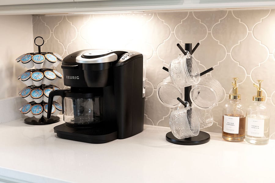 Full stocked coffee bar with pods, syrups, sugar and cream. We have pods and ground coffee available.