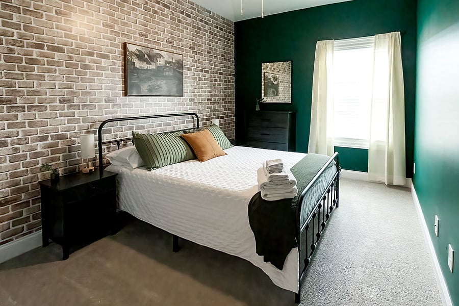 Queen room which memory foam mattress, full size closet, and luggage rack.