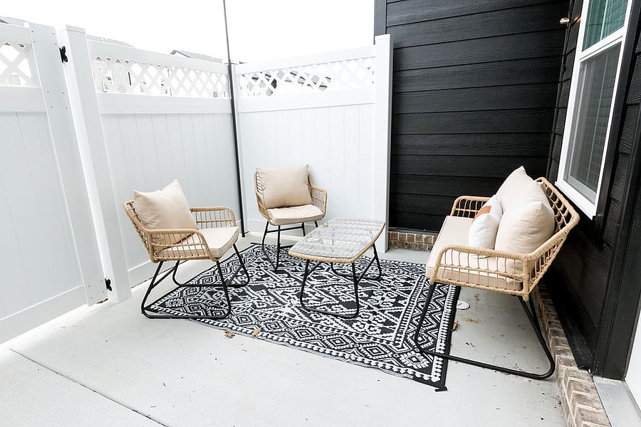 Private back patio with hanging egg chair
