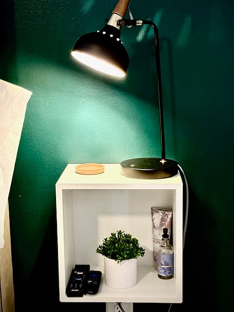 Great lighting near the bed for late night studying. The side tables are floating to keep the room feeling uncluttered.