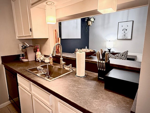 Kitchen that opens into the study area. A new deep stainless sink, Keurig coffee maker, & dishwasher.