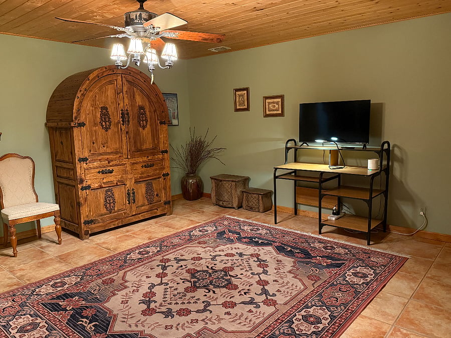 Desk and large couch, plenty of storage. Smart TV which can be used as a computer monitor.