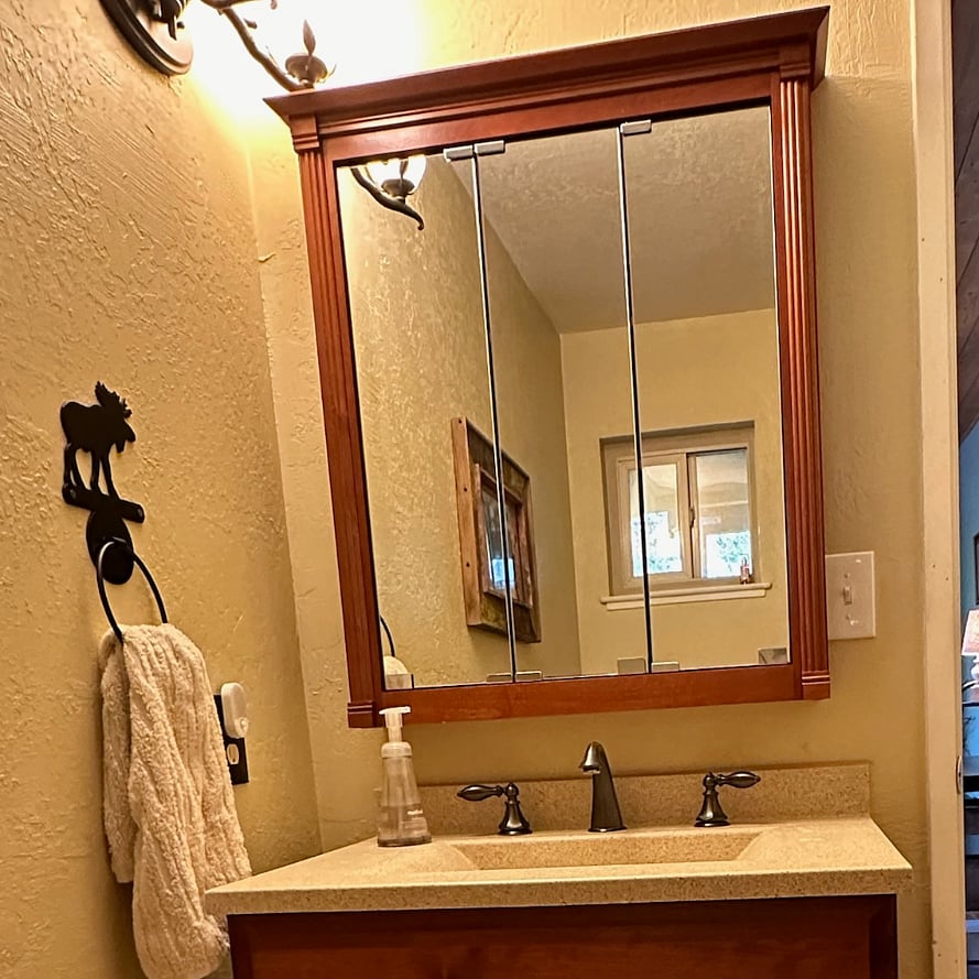 Bathroom sink and large mirror