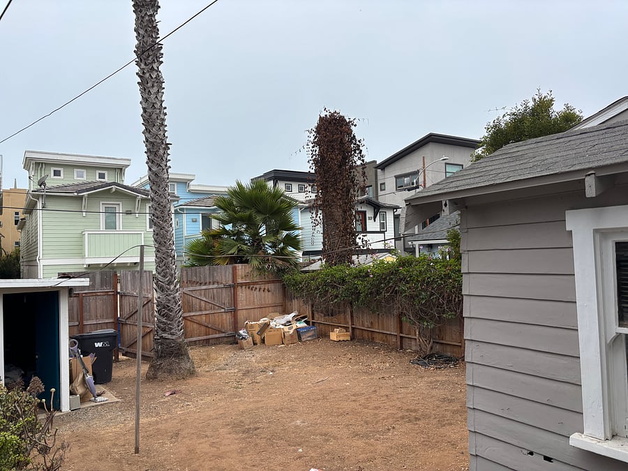 View of backyard from back door of house 