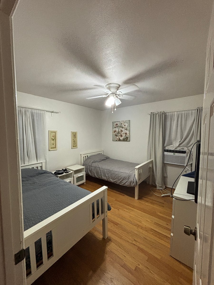 Bedroom w twin beds, closet, built in drawers and dresser