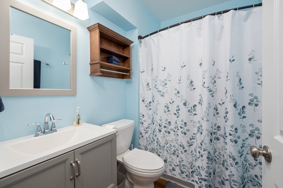 Full bathroom with tub and shower head