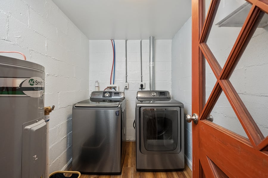 Laundry room in unit, shared with upstairs tenant. Ironing board and iron provided.