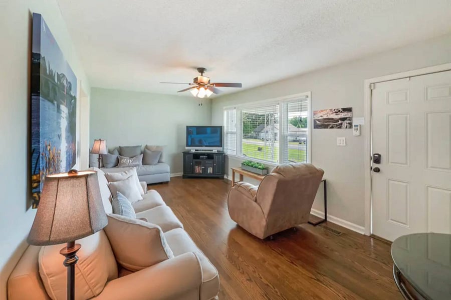 The front door leads into the cozy living room area