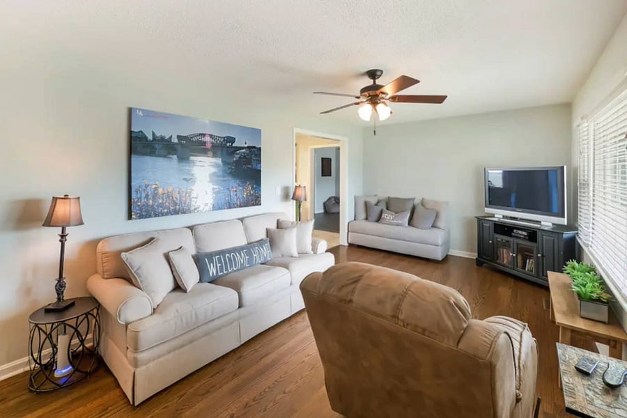 Living room with ample seating and large smart TV