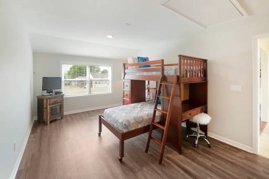 Bunkroom features a TV with a Nintendo gaming system with classic games like Legends of Zelda and Super Mario Cart