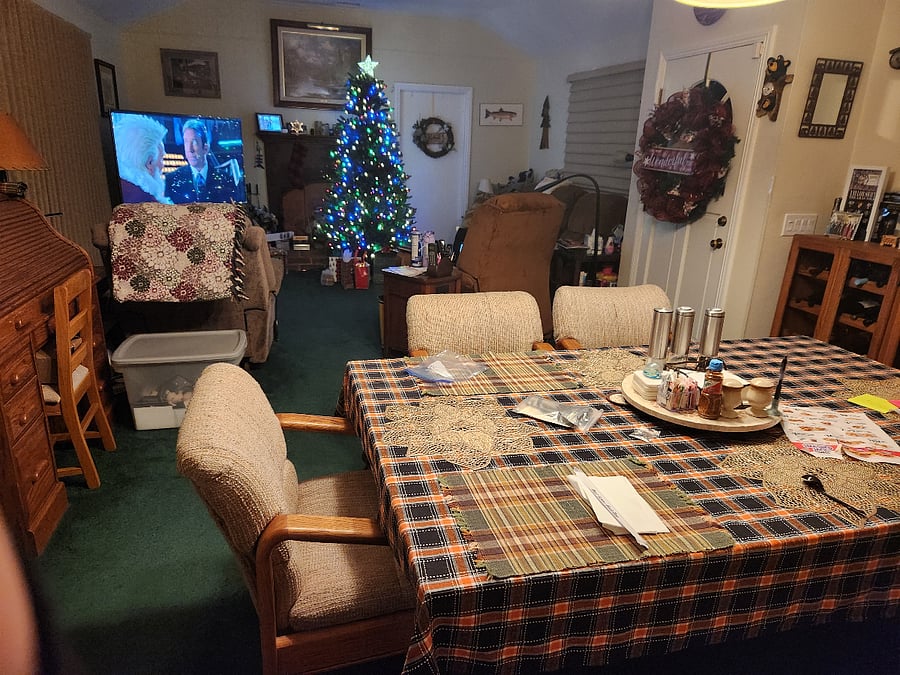 2 recliners and a couch with reclining sections.  Large dining room table.