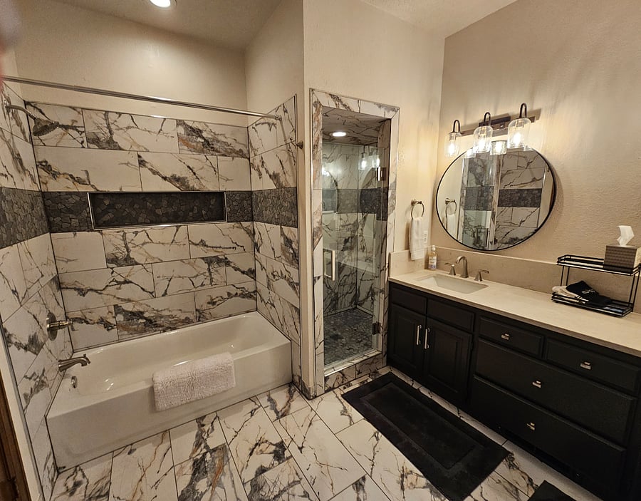 Master bathroom with walk in shower, separate soaking tub and plenty of storage..