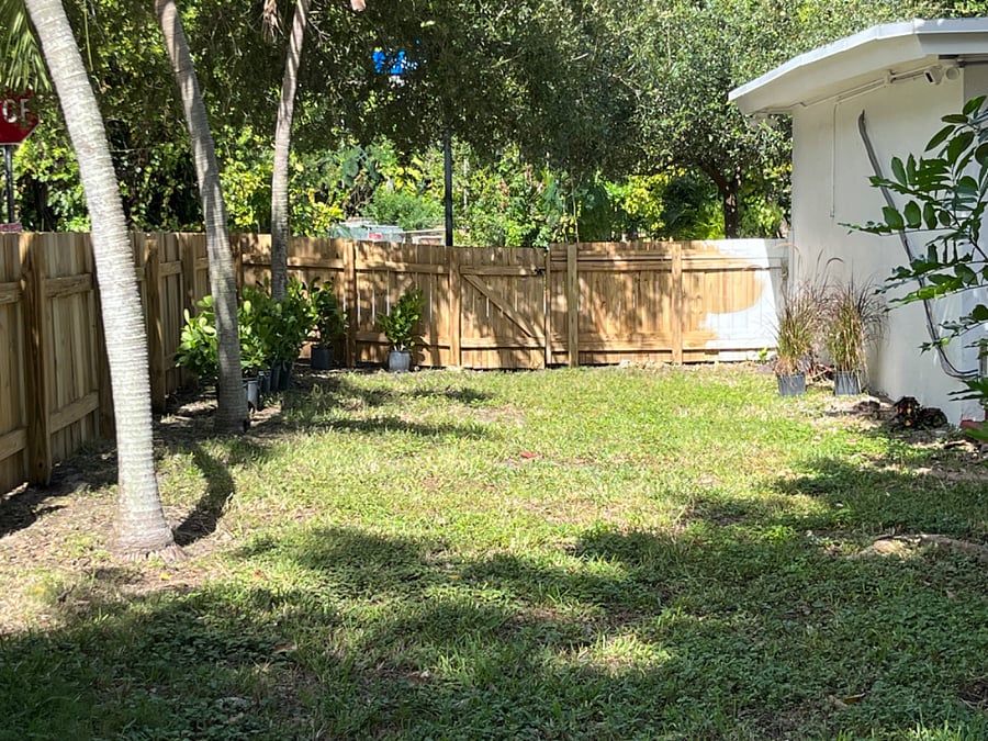 Fully fenced backyard with lush tropical vegetation, sun and shade for relaxing!