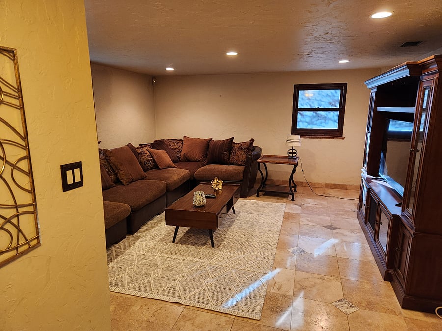 Garden level living room with huge, soft couch and 50" television!