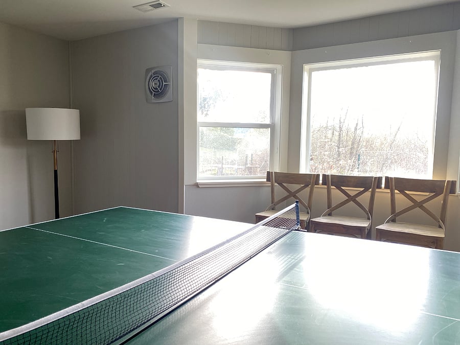 Separate game room has a ping pong table. In addition to the ping pong table, the game room has a Queen trundle couch/sofa bed (not pictured) that's available for additional sleeping.