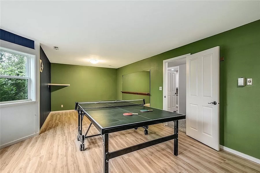 Bonus game room has a ping pong table. In addition to the ping pong table, the game room has a Queen trundle couch/sofa bed (not pictured) that's available for additional sleeping.