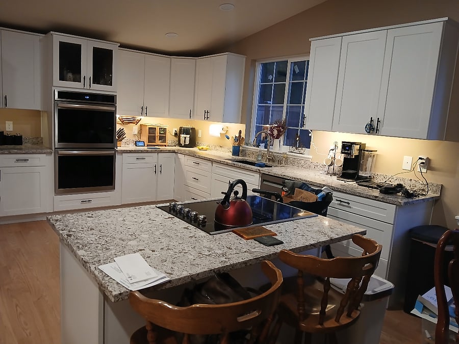 kitchen and sititng area next to dining room
