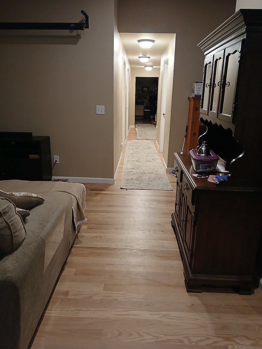 Long hallway , ends in the den