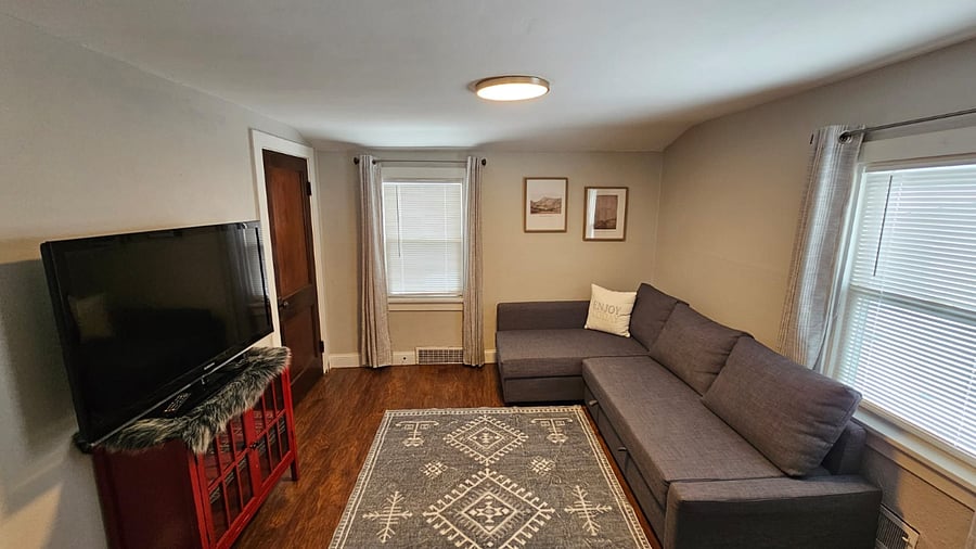 Living room with 1 of 3 closets