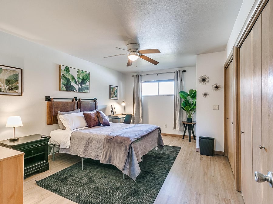 Bedroom #2 with queen size bed, double closet and desk with office chair.