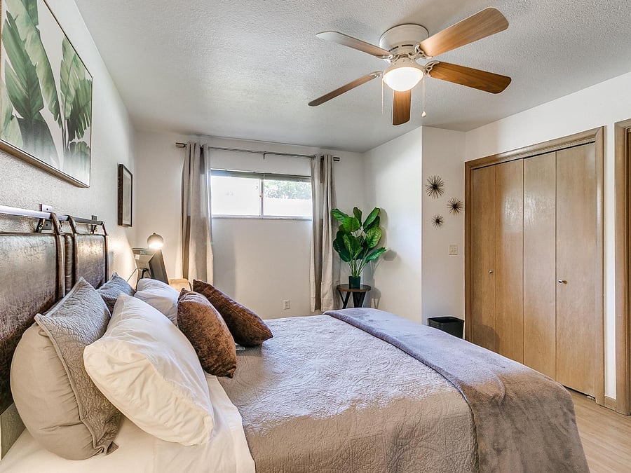 Bedroom #2 with queen size bed, double closet and desk with office chair.