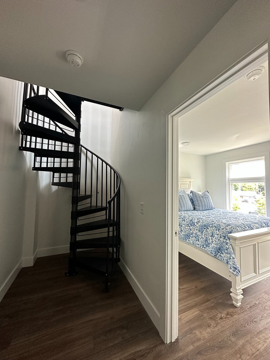 Winding Staircase Leading to Private Rooftop Deck