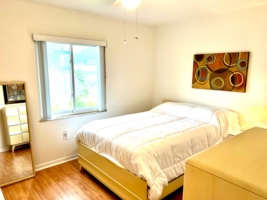 Master bedroom with full-size bed. View 1. 