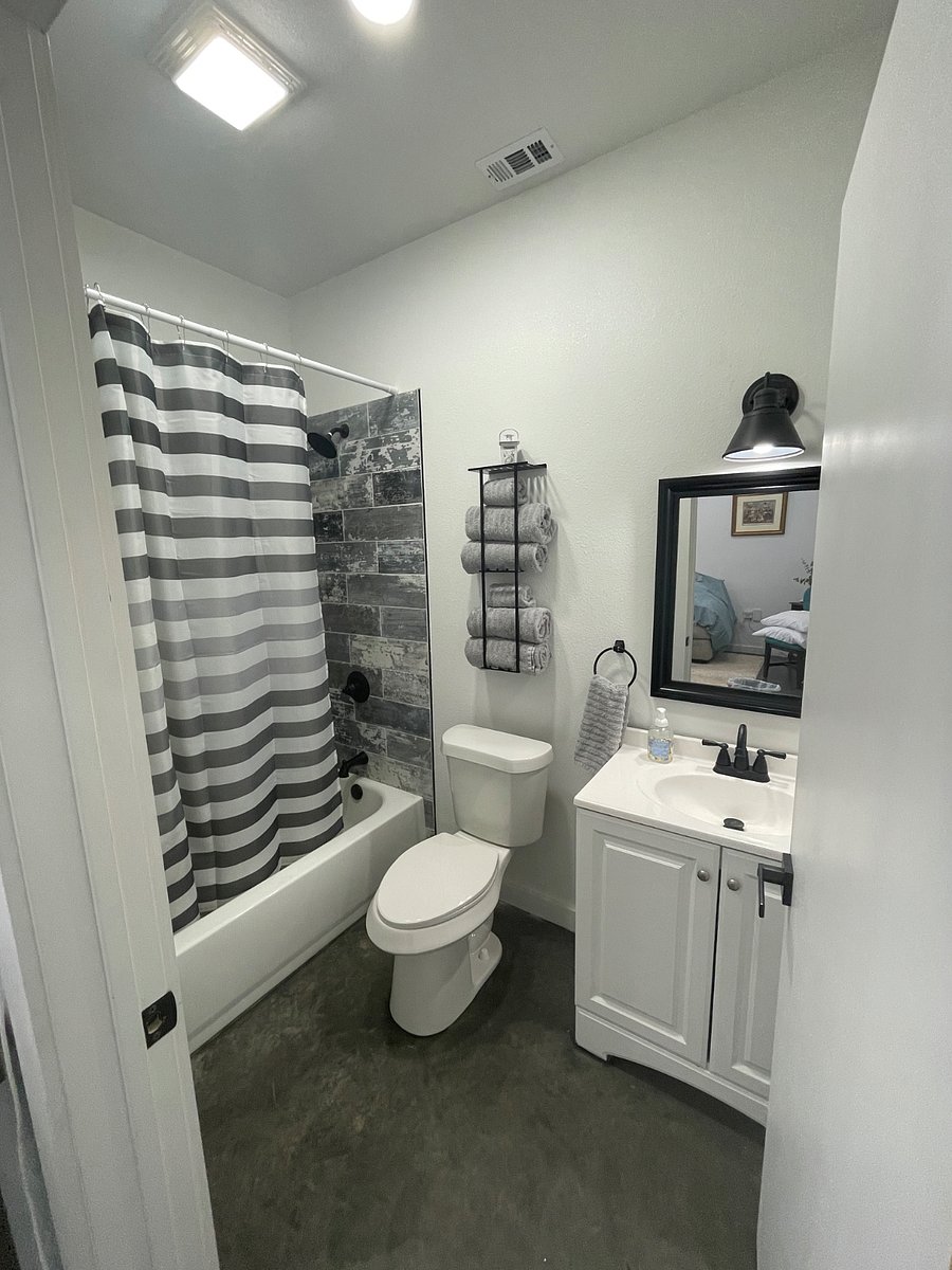 Clean and modern bathroom with fresh towels, a spacious shower, and all the essentials to make your stay comfortable. Thoughtfully stocked with toiletries so you can pack light.