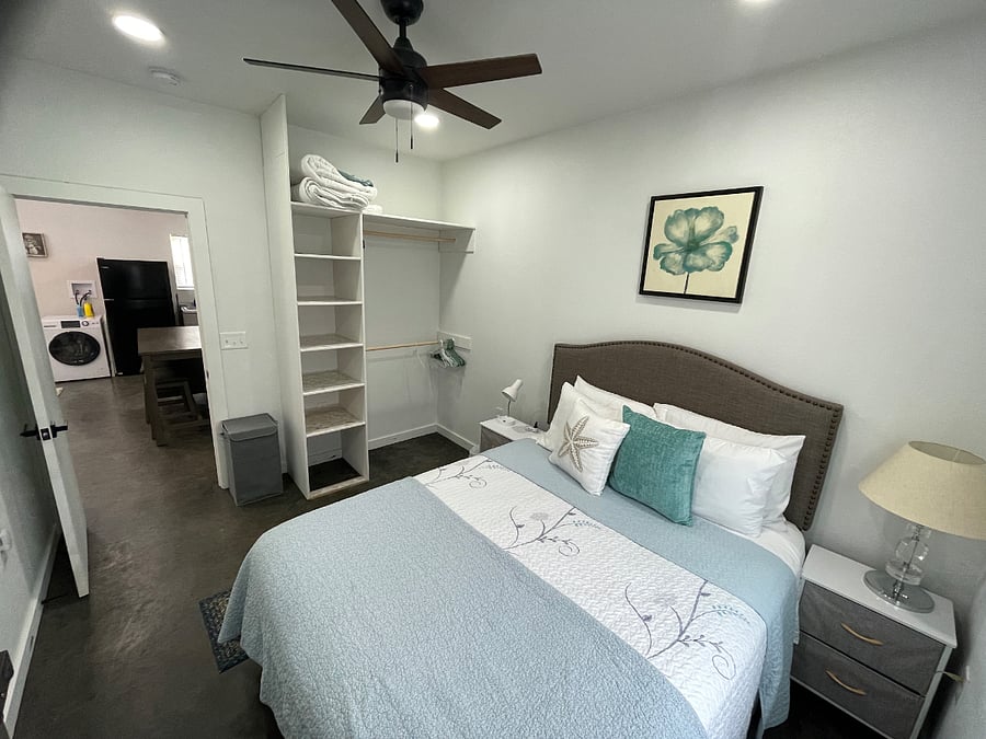 Bedroom 1 
Comfortable and serene bedroom with a plush queen bed, soft linens, and calming decor designed to help you unwind and sleep soundly. Includes bedside lighting, storage space, and a ceiling fan for added comfort.