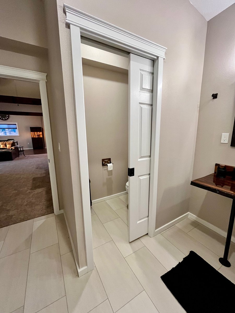 pocket door entrance to toilet space in bathroom