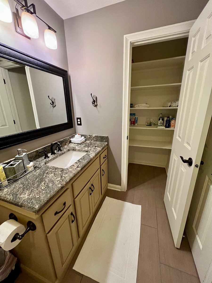 private, updated bathroom with extra storage closet