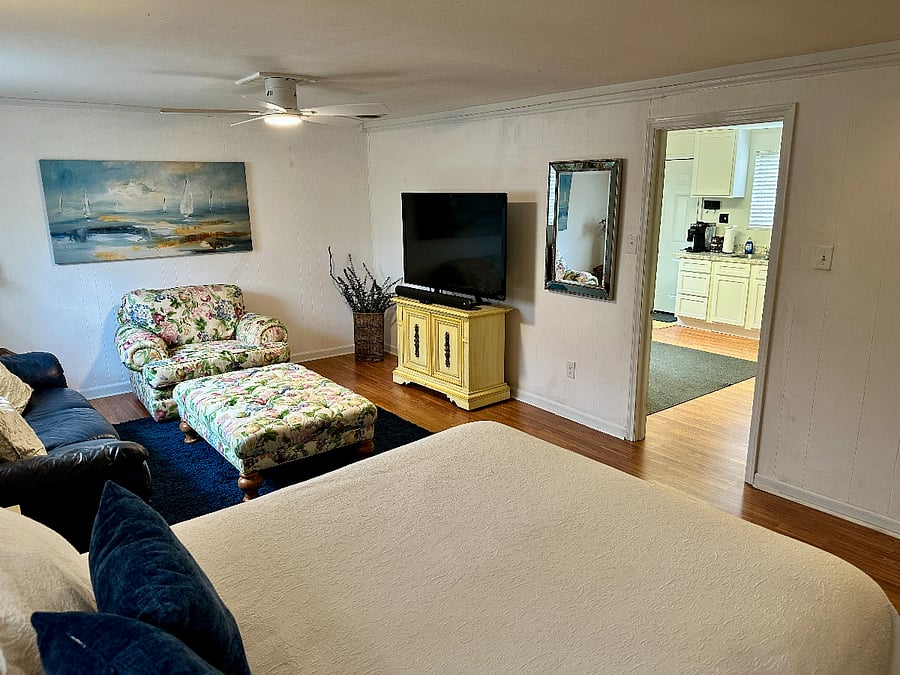 Queen bed and living area.