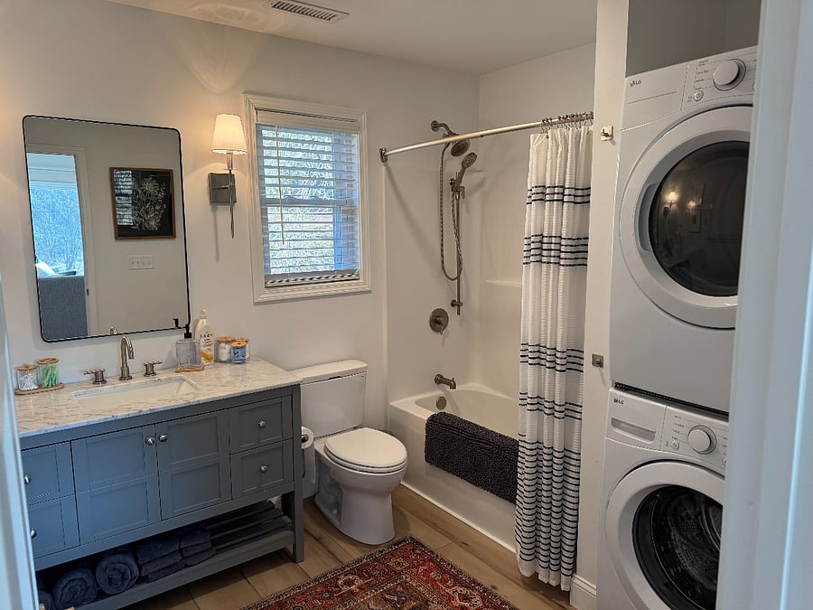 Full bath with laundry set.