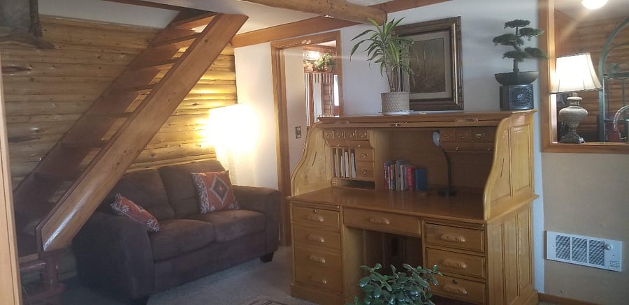 Partial shot of den, hard to get whole rooms w/ Phone. One bathroom entrance under stairs